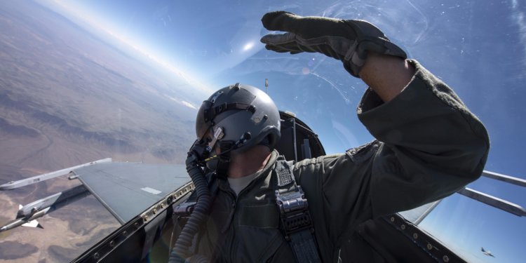 Fighter pilot in cockpit demonstrating the importance of cervical strength for OHWS readiness